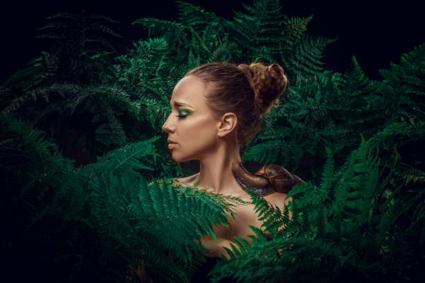 istock Mother Nature figure with snails 1325033505