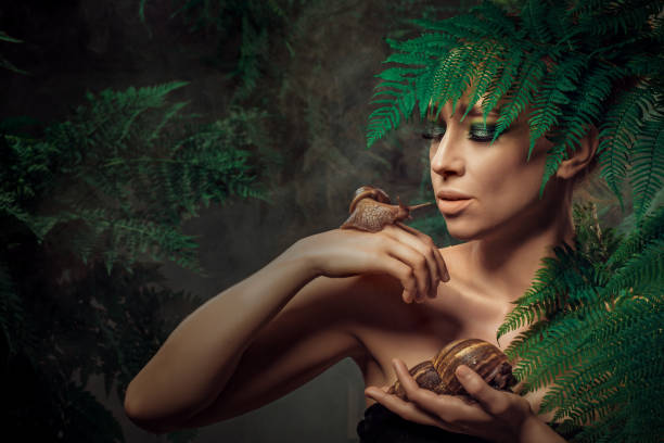 istock Mother Nature figure with snails 1325033543