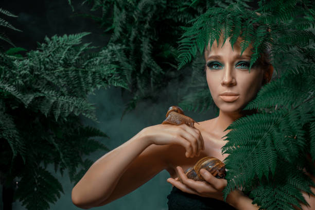 istock Mother Nature figure with snails 1325033795