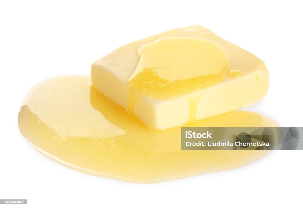 Tasty fresh melting butter on white background Butter Stock Photo