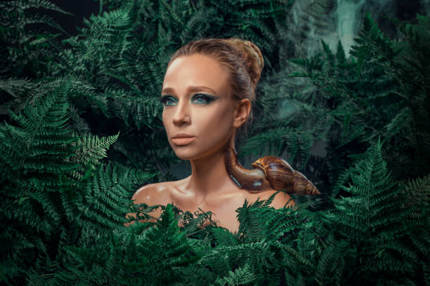 istock Mother Nature figure with snails 1325034333