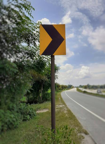 istock Yellow colour right curve sign plate at the highway 1325034341