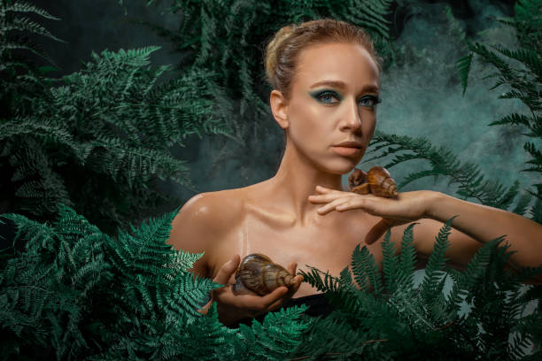 istock Mother Nature figure with snails 1325034366