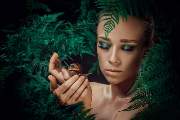 istock Mother Nature figure with snails 1325034389