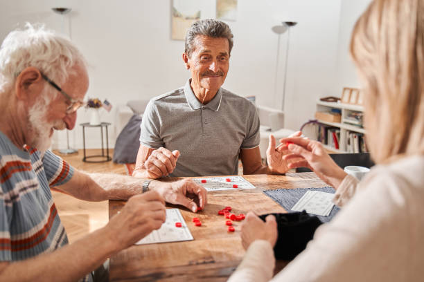 istock Seniors spending time together playing at the retro board game 1325035919