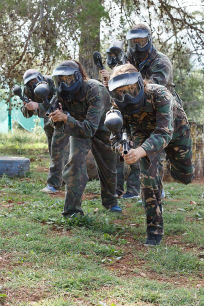 istock Group of people playing paintball 1325037885