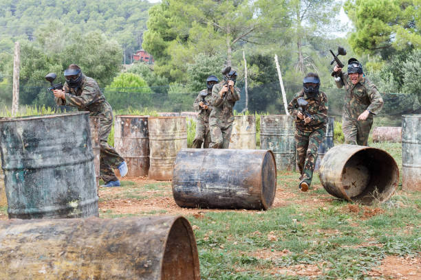 istock Group of people playing paintball 1325037889