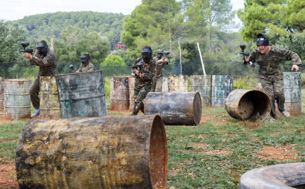 istock Group of people playing paintball 1325037891