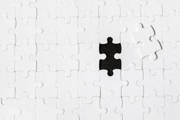 istock White jigsaw puzzle. White puzzle pieces on color background. Unfinished white jigsaw puzzle pieces on color background. 1325039325
