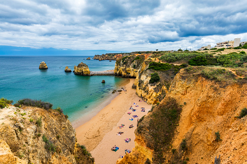 Praia Dona Ana beach with turquoise sea water and cliffs, Portugal. Beautiful Dona Ana Beach (Praia Dona Ana) in Lagos, Algarve, Portugal.