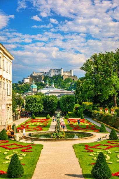 Beautiful view of famous Mirabell Gardens with the old historic Fortress Hohensalzburg in the background in Salzburg, Austria. Famous Mirabell Gardens with historic Fortress in Salzburg, Austria. Beautiful view of famous Mirabell Gardens with the old historic Fortress Hohensalzburg in the background in Salzburg, Austria. Famous Mirabell Gardens with historic Fortress in Salzburg, Austria. salzburg stock pictures, royalty-free photos & images