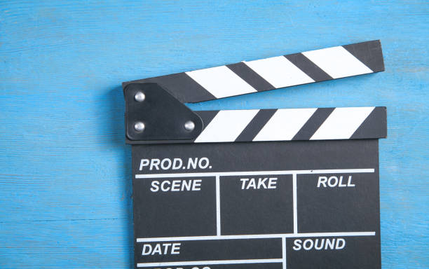 istock Movie clapper on the blue background. 1325041995