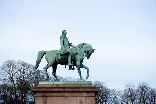 Oslo, Norway - February 24, 2020. Equetrian statue of King Charles XIV John (Karl XIV Johan) in front of the Royal Palace in Oslo, Norway