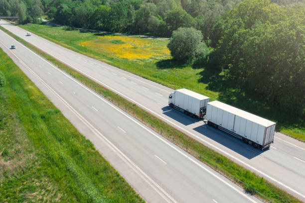 istock Truck with trailer on the highway 1325043382