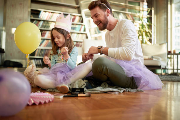 istock A young father and his little daughter spending a quality time together while preparing for a ballet training at home. Family, together, home 1325043542