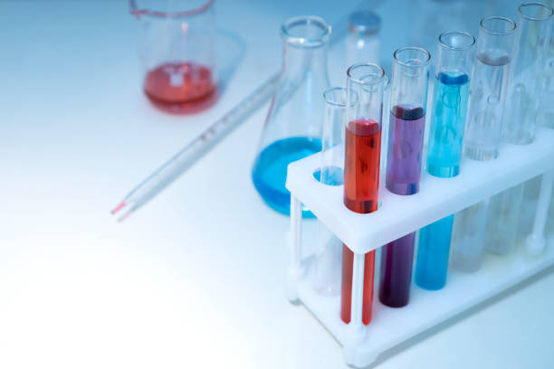 istock Glassware full of chemical liquid on the lab table.Empty space 1325043710