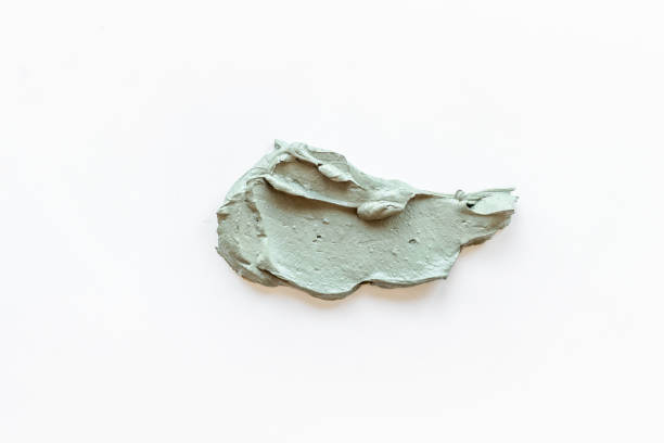 istock Cosmetic blue clay mask isolated on white background 1325045976