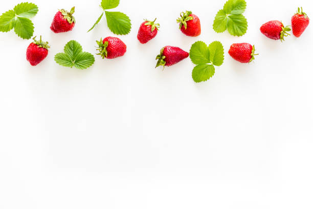 istock Red ripe strawberries with green leaves. Top view 1325046494