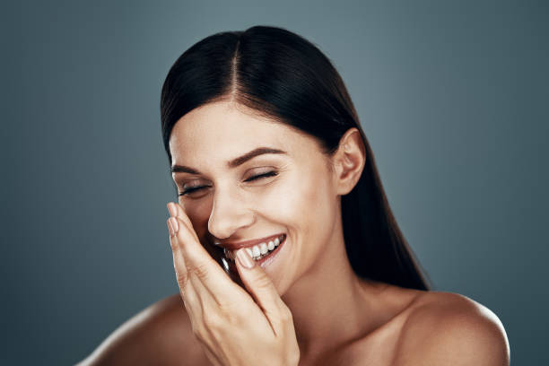 istock Beautiful young woman smiling 1325047145