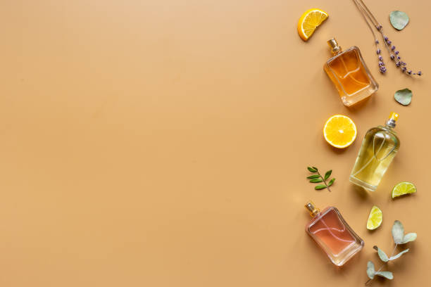 istock Perfume bottles with leaves and fruits, top view 1325051025