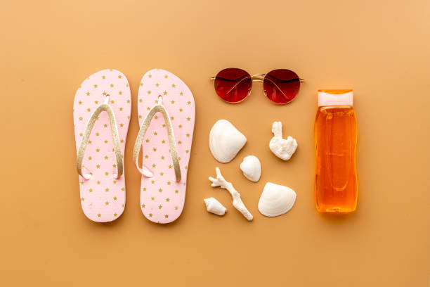 istock Tropical summer vacation background. Flip flops with towel and sunglasses 1325052115