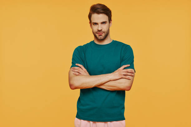 istock Handsome young man in casual clothing looking at camera 1325052836