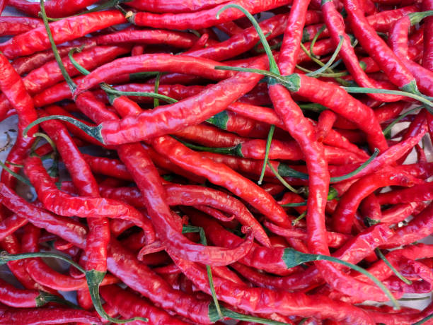 istock Large pile of chili in the display case 1325054702