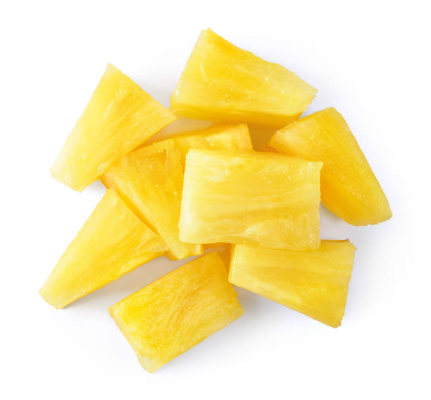 Canned pineapple chunks. Pineapple slices isolated. Pineapple top view. Canned pineapple chunks. Pineapple slices isolated. Pineapple top view. Pineapple Chunks stock pictures, royalty-free photos & images