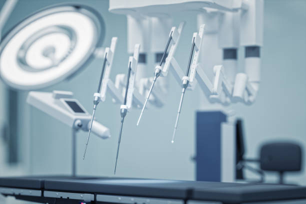 Robotic Surgery Equipment Close-Up Close-up view of robotic surgical arms in an operating room. robotic arm lab stock pictures, royalty-free photos & images