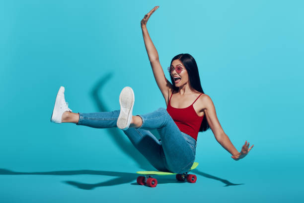 istock Playful young woman smiling 1325057464