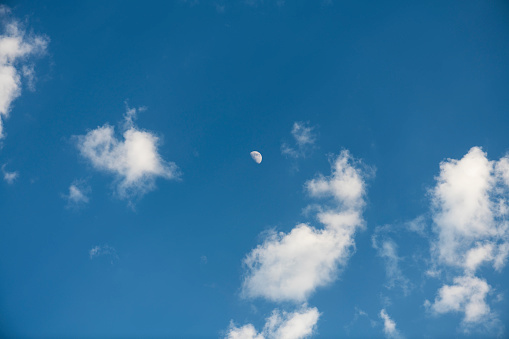 Beautiful blue sky and clouds with moon. Sky, moon background