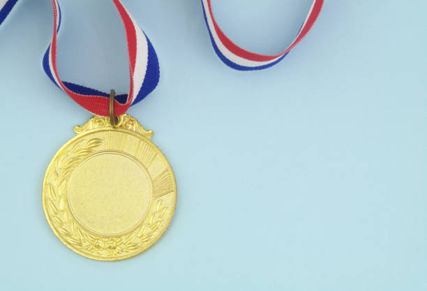 istock Gold medal on blue background 1325062087
