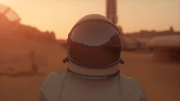 istock Astronaut on the planet Mars. Astronaut walking on the surface of Mars. Colonization concept. 3d rendering 1325063377