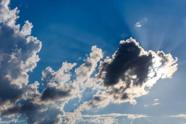 istock white c cumulus clouds on blue sky background 1325065588