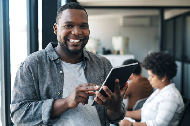 istock Shot of a young businessman using a digital tablet in an office 1325068388