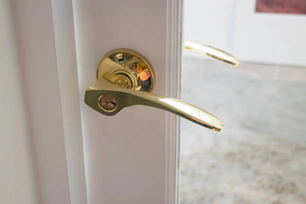 istock Golden handles on a glass door 1325071675