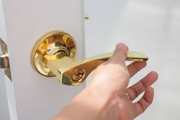 istock Golden handles on a glass door 1325071746