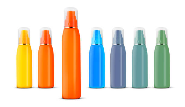 Three orange container suntan isolated on white background Group of cosmetic spray bottles isolated on a white background. air freshener spray stock pictures, royalty-free photos & images