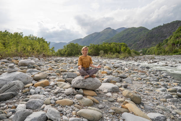 Young woman meditating in nature