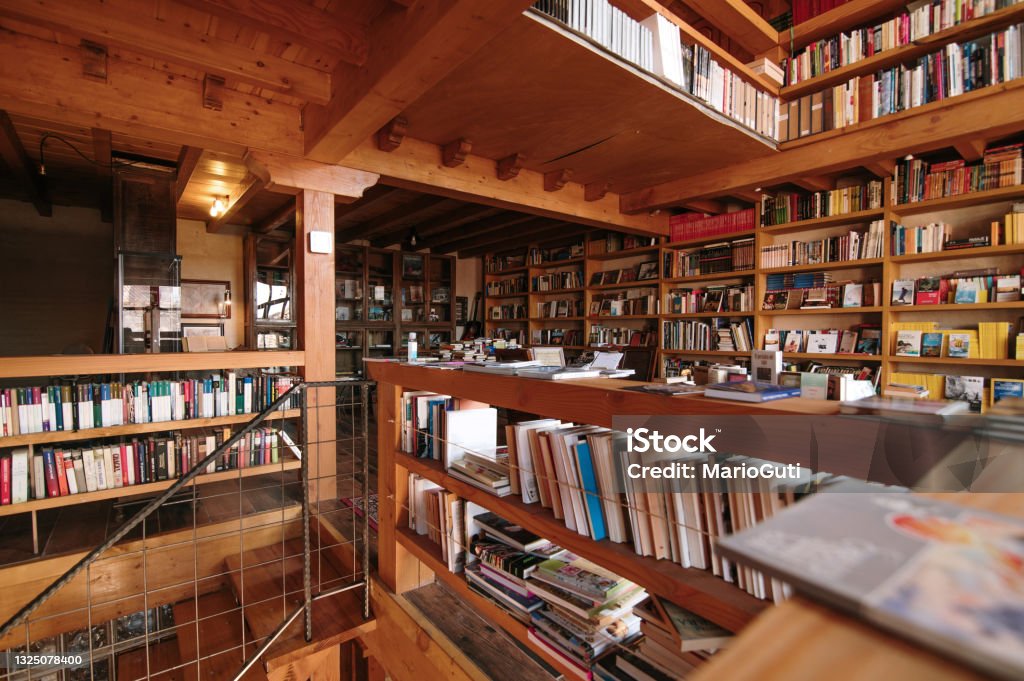 Library with wooden furniture Interior view of a library with rustic style and wooden elements and furniture Bookstore Stock Photo