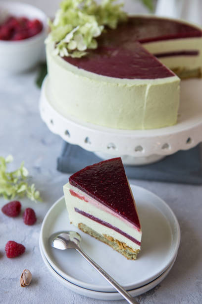 istock Raspberry pistachio cake. Devils cake. Wedding dessert. Birthday party cake. Delicious dessert. 1325079857