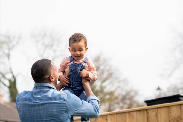 istock Father & Son Bonding in the Garden 1325080624