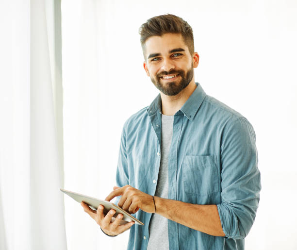 istock portrait man tablet technology male computer young happy lifestyle handsome smiling digital internet online 1325082568