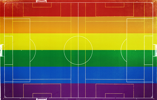 A LGTB flag on a soccer field as seen from above