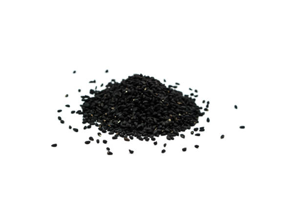 istock Real black cumin isolated on white background top view 1325082652
