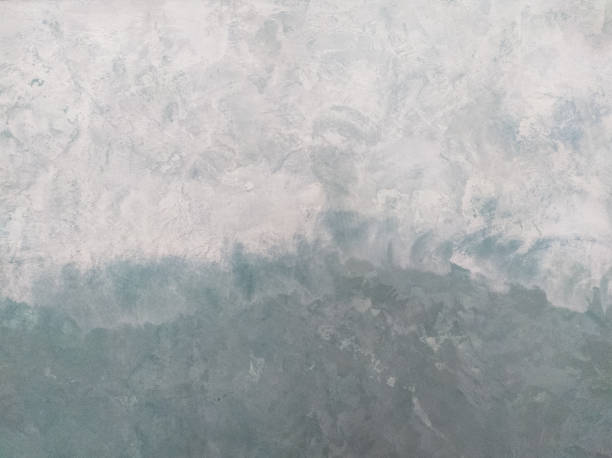 istock Plaster wall texture background.  Gradient putty.  The transition from gray to green. 1325083418