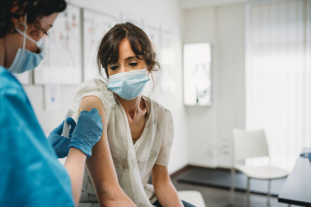 istock A woman is getting vaccinated in a medical clinic 1325085013