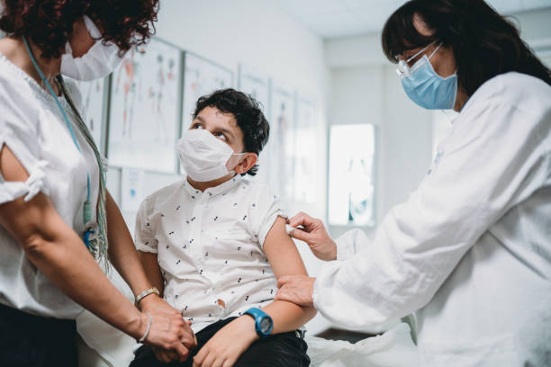 istock A mother is standing by her child while he's getting vaccinated 1325085139