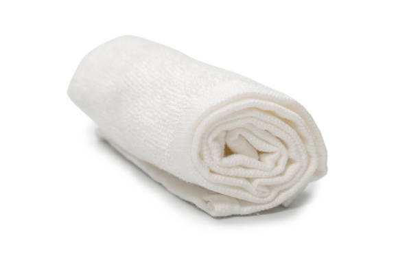 istock White fluffy cotton towel isolated on a white background. 1325085406