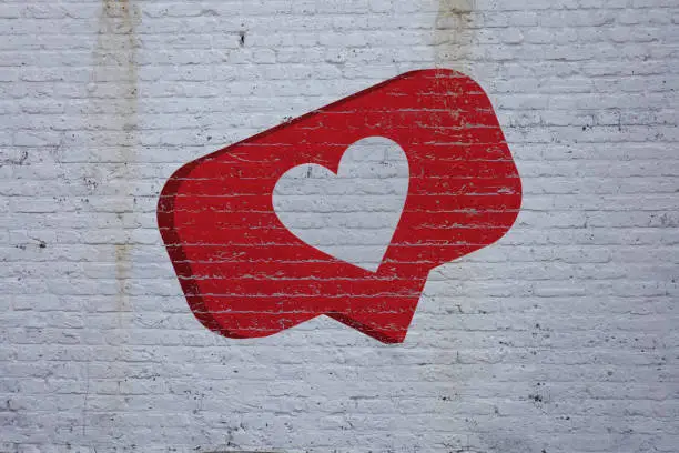 Photo of Heart shape on the brick wall